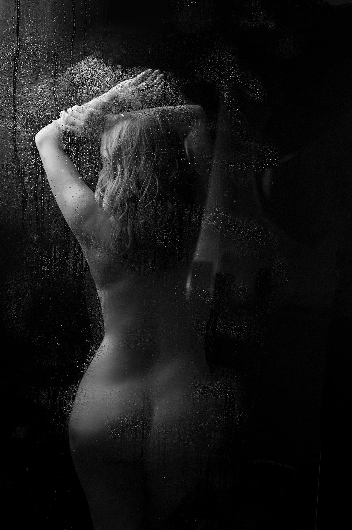 Woman does her boudoir session in a shower with Shannon Hemauer Photography, located in Carlisle PA.