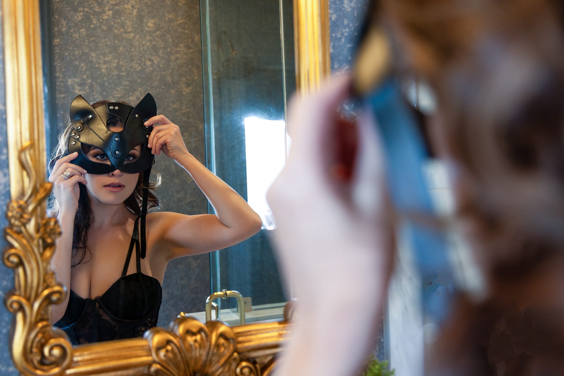 Woman poses with cat mask on for her boudoir session with Shannon Hemauer Photography, located near York, PA.